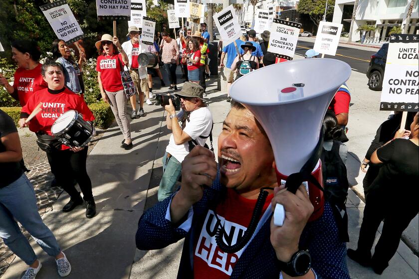 Santa Monica, CA - Members of Unite Here! Local 11 hotel workers union and members of the Writers Guild of America picket together outside the Fairmont Miramar Hotel in Santa Monica on Thursday, July 13, 2023. (Luis Sinco / Los Angeles Times)