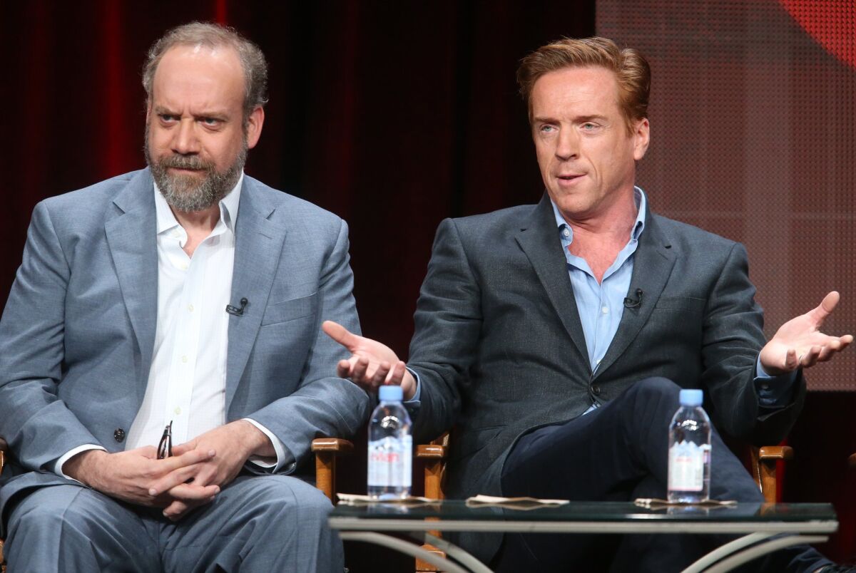 Paul Giamatti, left, and Damian Lewis speak onstage during the "Billions" panel discussion at the Showtime portion of the 2015 Summer TCA Tour.