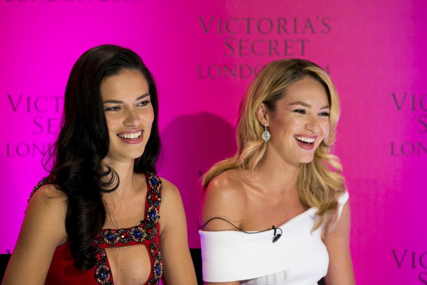Victoria's Secret models Adriana Lima and Candice Swanepoel during a news conference at the Victoria's Secret New Bond Street store in central London on Tuesday. The Victoria's Secret models have announced the Victoria's Secret Fashion Show will be coming to London this year.