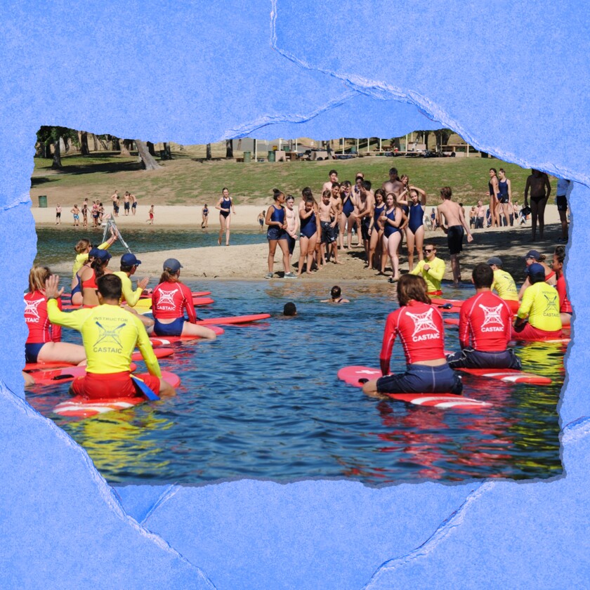 A group of people at a lake.