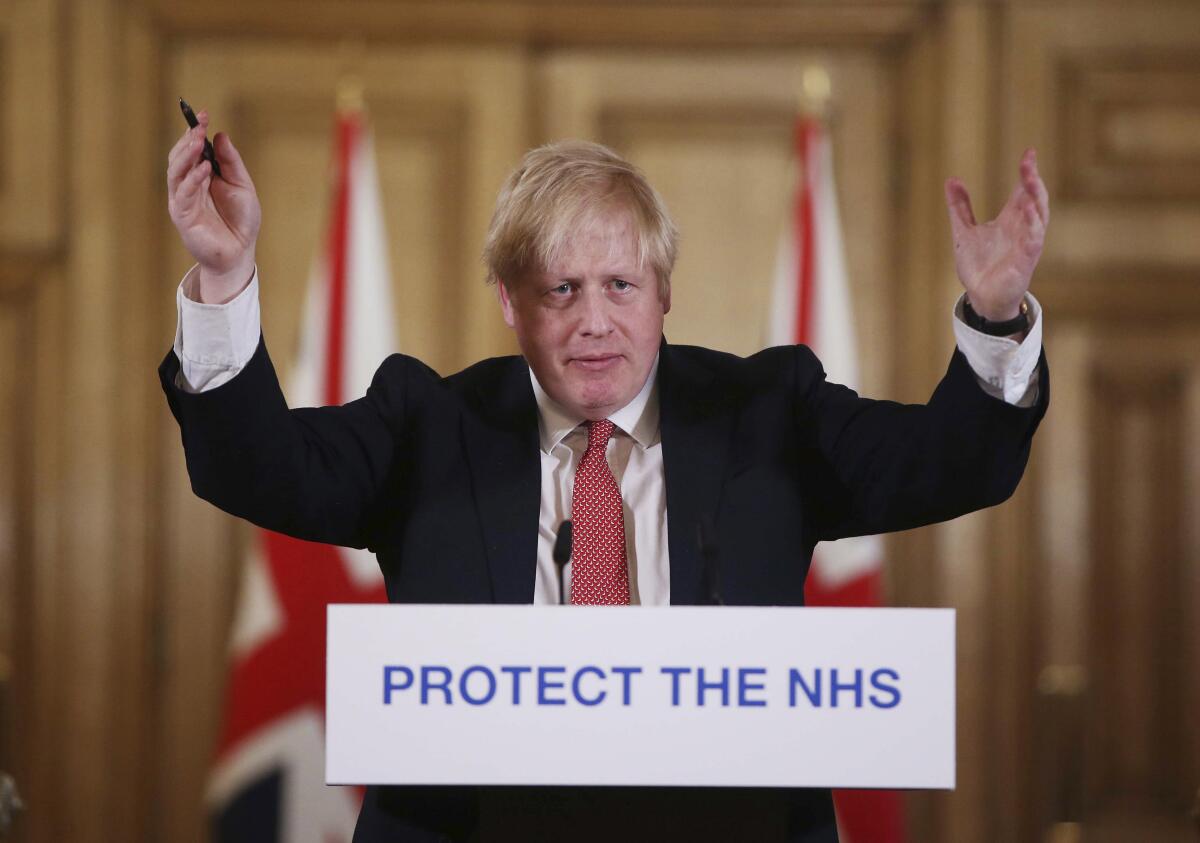 British Prime Minister Boris Johnson speaks during a coronavirus press briefing to announce new measures to limit the spread of the virus, at Downing Street in London on March 22.
