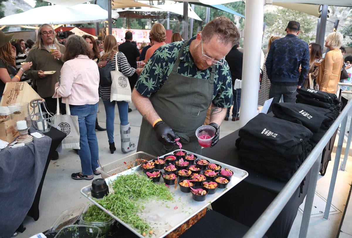 Greg Daniels prepares roasted cauliflower from Harley's Laguna Beach restaurant during the Taste of Laguna.