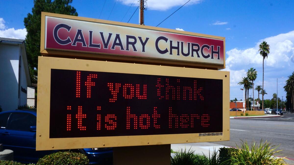 A digital display at a church makes fun of the heat in West Hills, where temperatures reached 113 degrees Thursday.