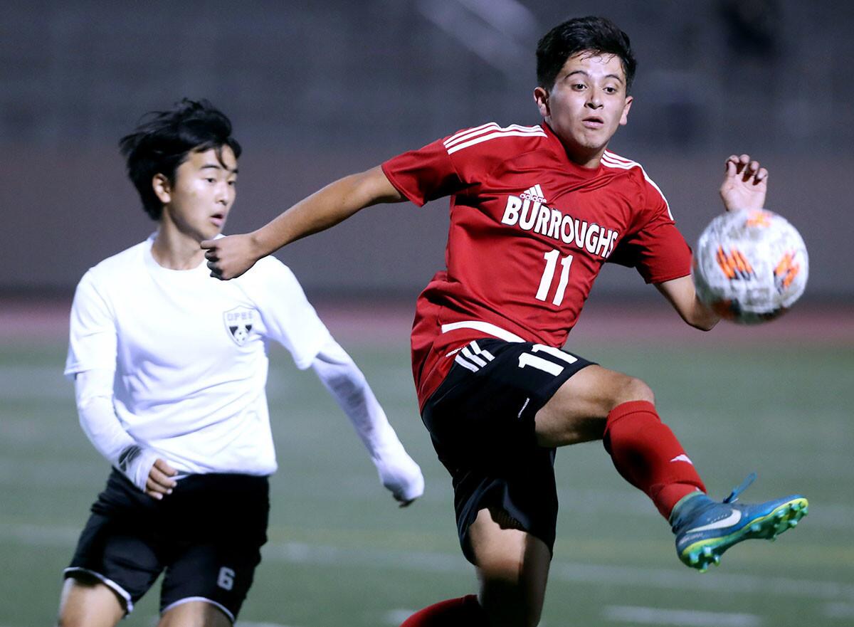 Burroughs High School soccer player Carlos Rosales controls the ball in game vs. Oak Park High in the Ralph Brandt Tournament, at Memorial Field in Burbank on Wednesday, Nov, 28, 2018.