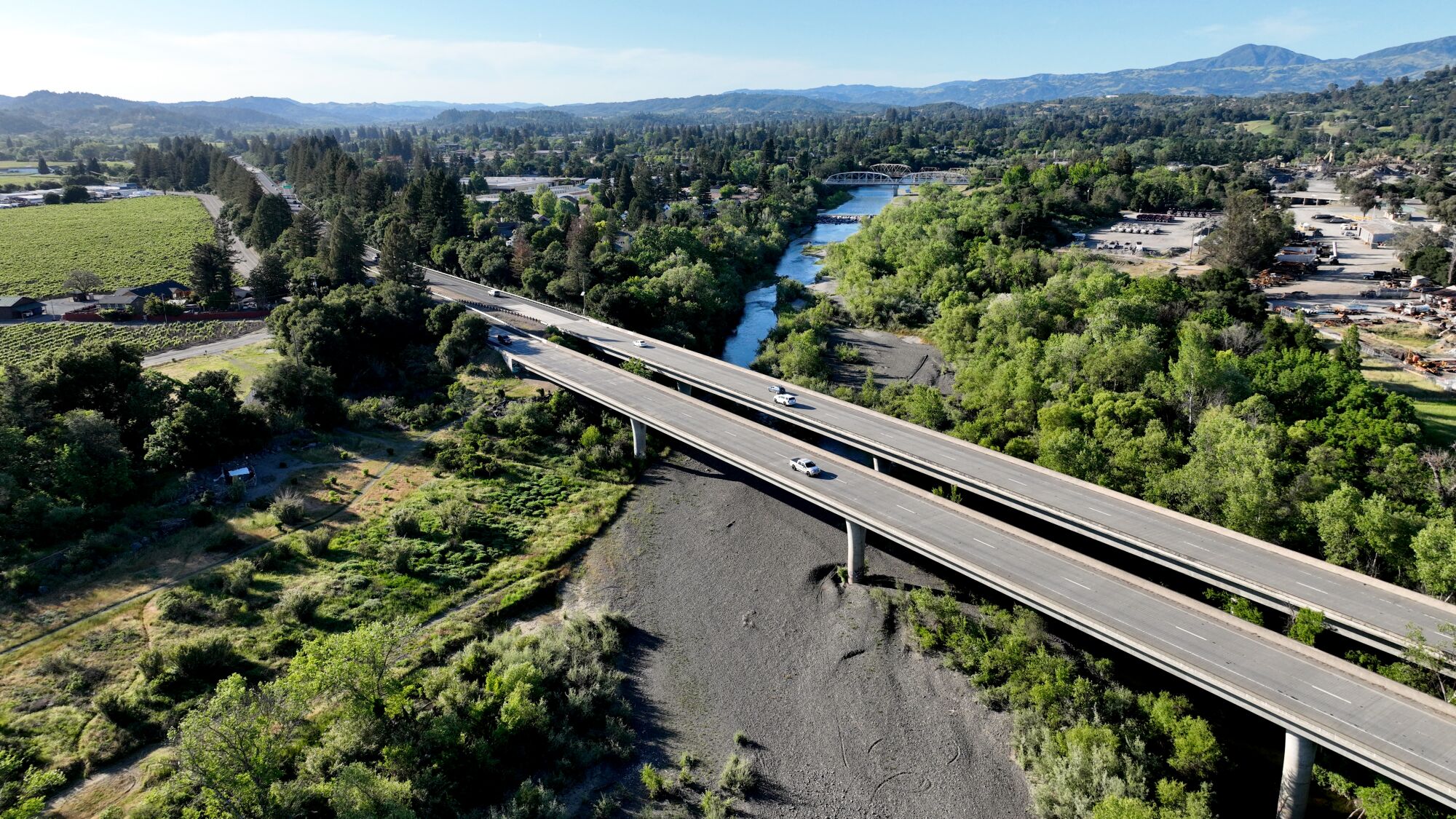 An aerial view of Highway 101 as it crosses over a nearly dry section of the Russian River in Healdsburg.