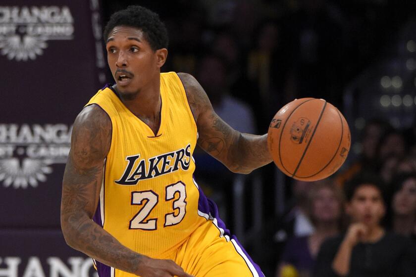 Lakers guard Lou Williams brings the ball up court during a game against the Nuggets on Nov. 3.