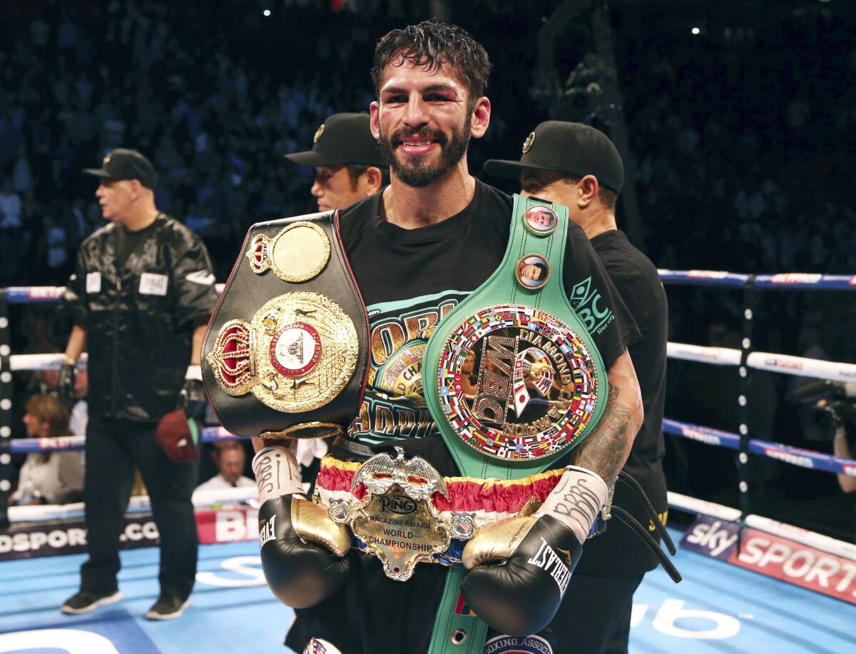 Jorge Linares poses with his belts after beating Anthony Crolla on Sept. 24, 2016.