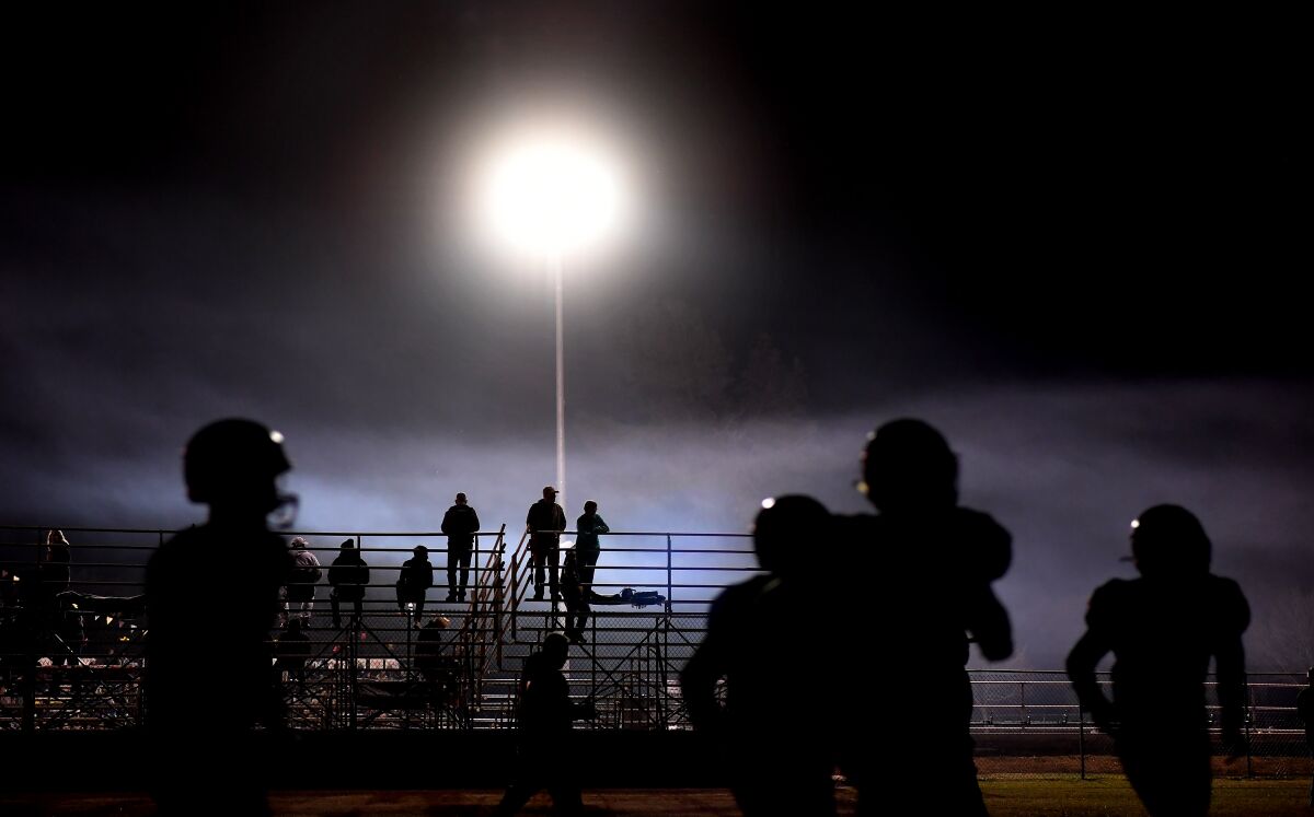 Paradise High School fans watch the players warm-up before a game against West Valley.