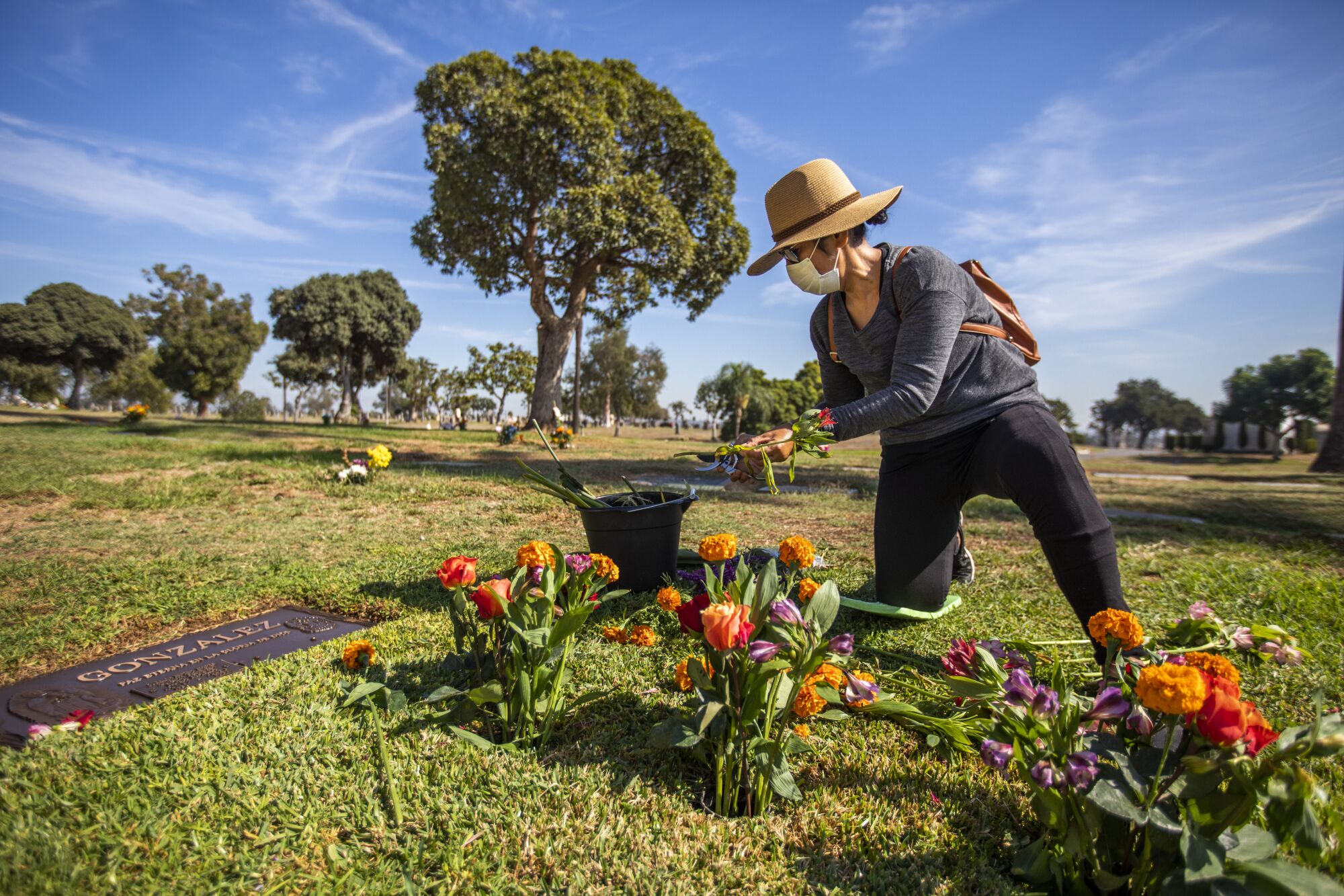 A woman at a grave.