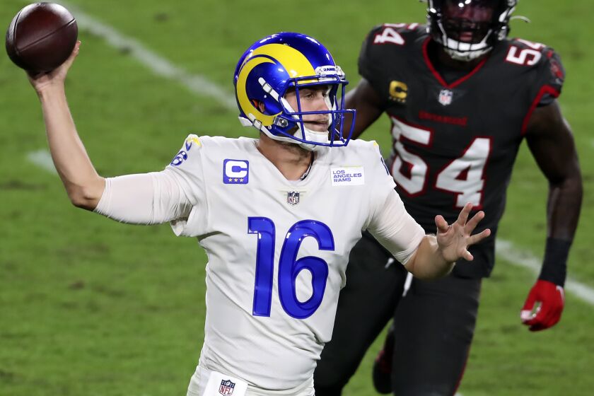Los Angeles Rams quarterback Jared Goff (16) throws a pass as he is pressured by Tampa Bay Buccaneers.