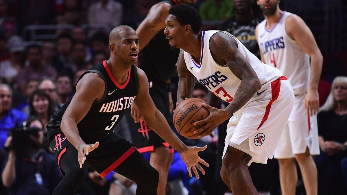 Houston's Chris Paul, left, guards the Clippers' Lou Williams on Jan. 15 at Staples Center.