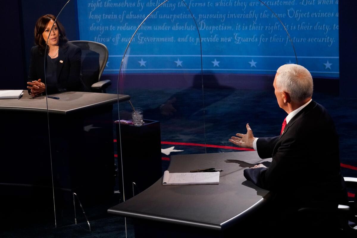Sen. Kamala Harris and Vice President Mike Pence during the vice presidential debate Wednesday at the University of Utah.