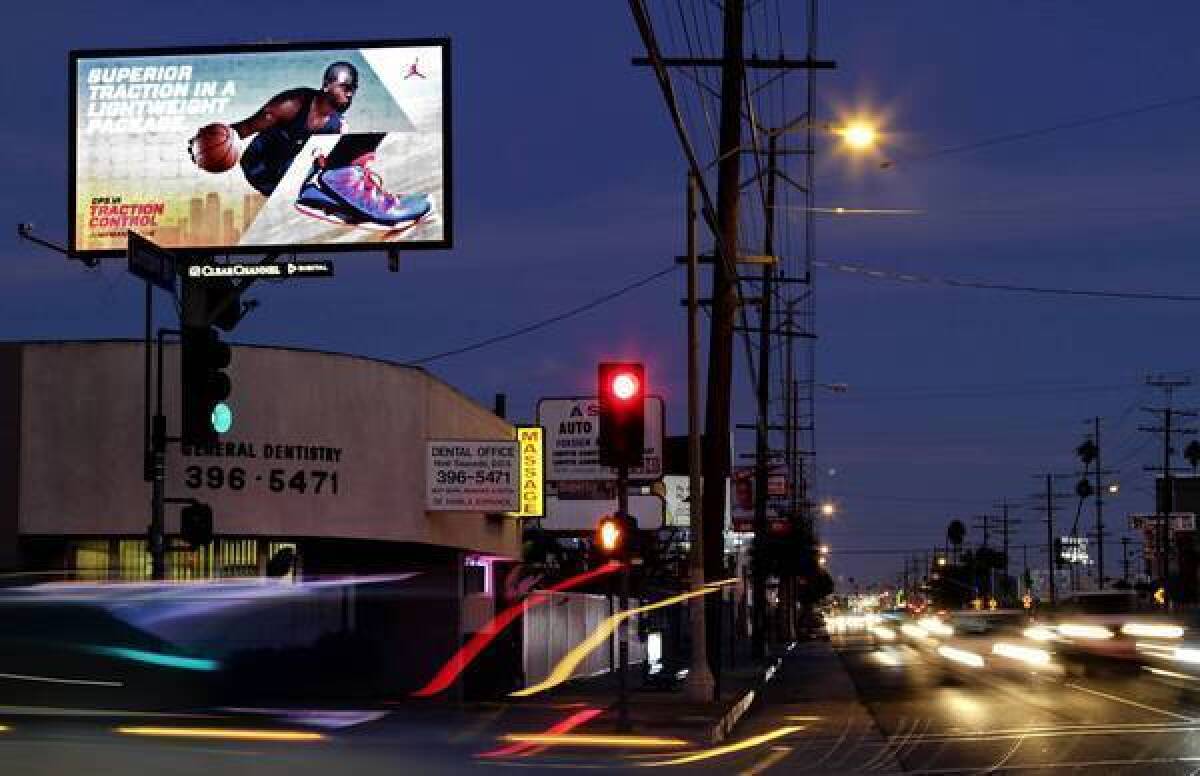 Digital billboards such as this one in Venice are the focus of a ruling that will pull the plug on dozens of signs.