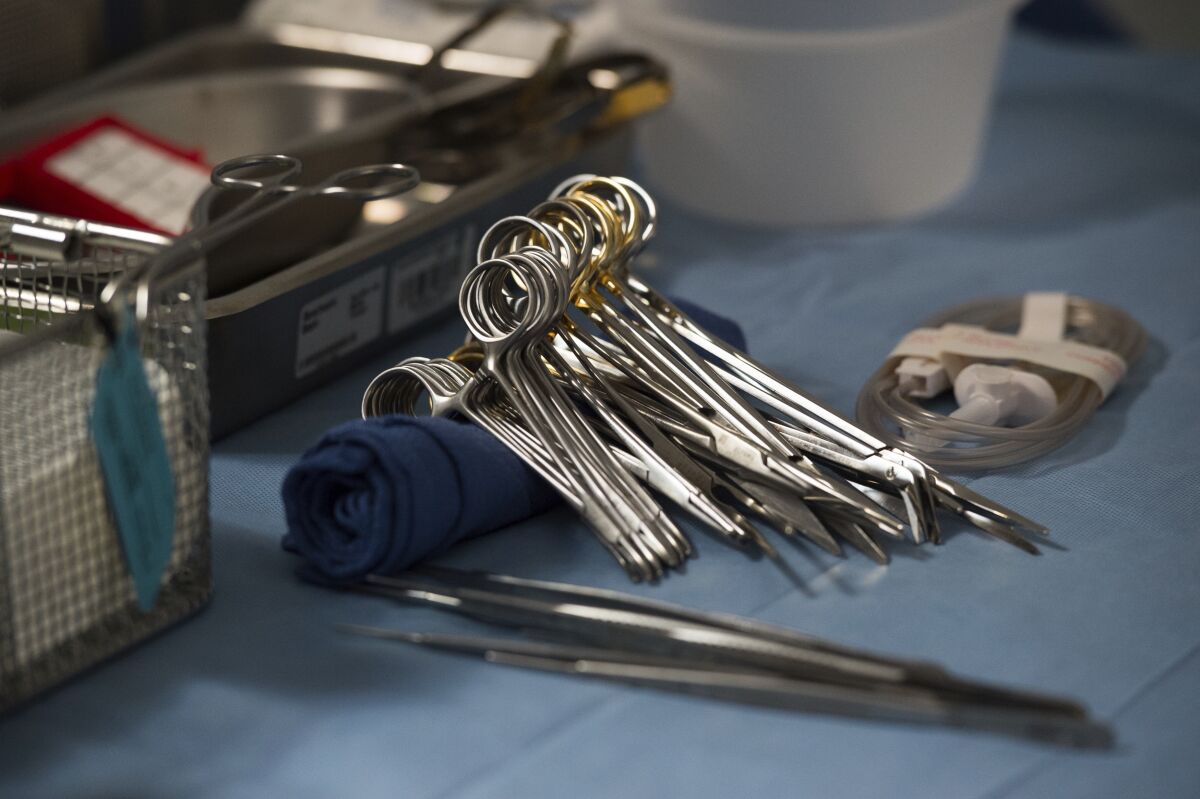 FILE - Surgical instruments and supplies lay on a table during a kidney transplant surgery at MedStar Georgetown University Hospital in Washington D.C., Tuesday, June 28, 2016. The Biden administration said Wednesday, March 22, 2023, that it will attempt to break up the network that runs the nation’s organ transplant system as part of a broader modernization effort. (AP Photo/Molly Riley, File)
