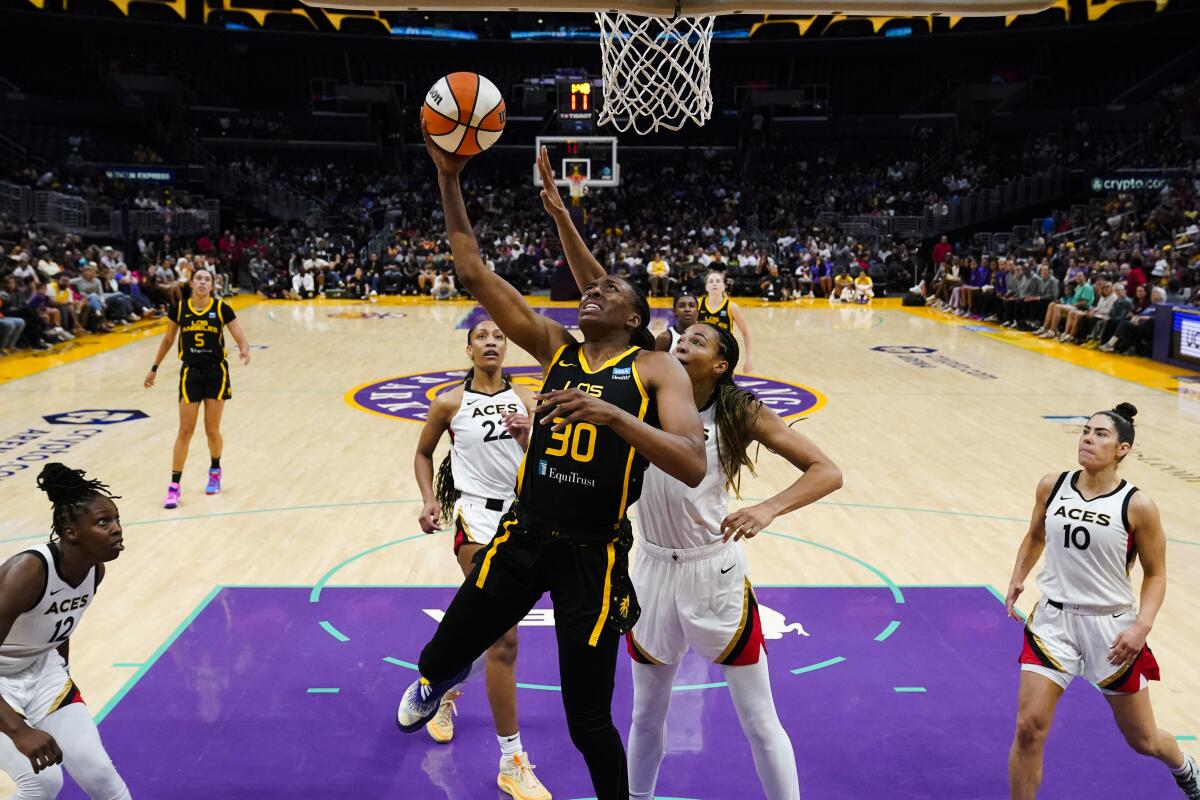 Sparks forward Nneka Ogwumike lays the ball up against the Las Vegas Aces.
