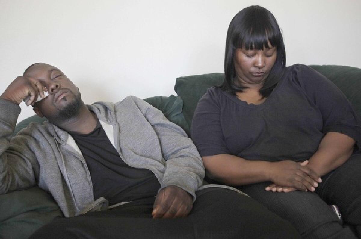 Deandre Franks, 22, the boy's father, and Sharlynn Pinkard, the boy's grandmother, react in the wake of the death of Deandre Green, 2. Franks says he had gone to police with his suspicions of abuse.
