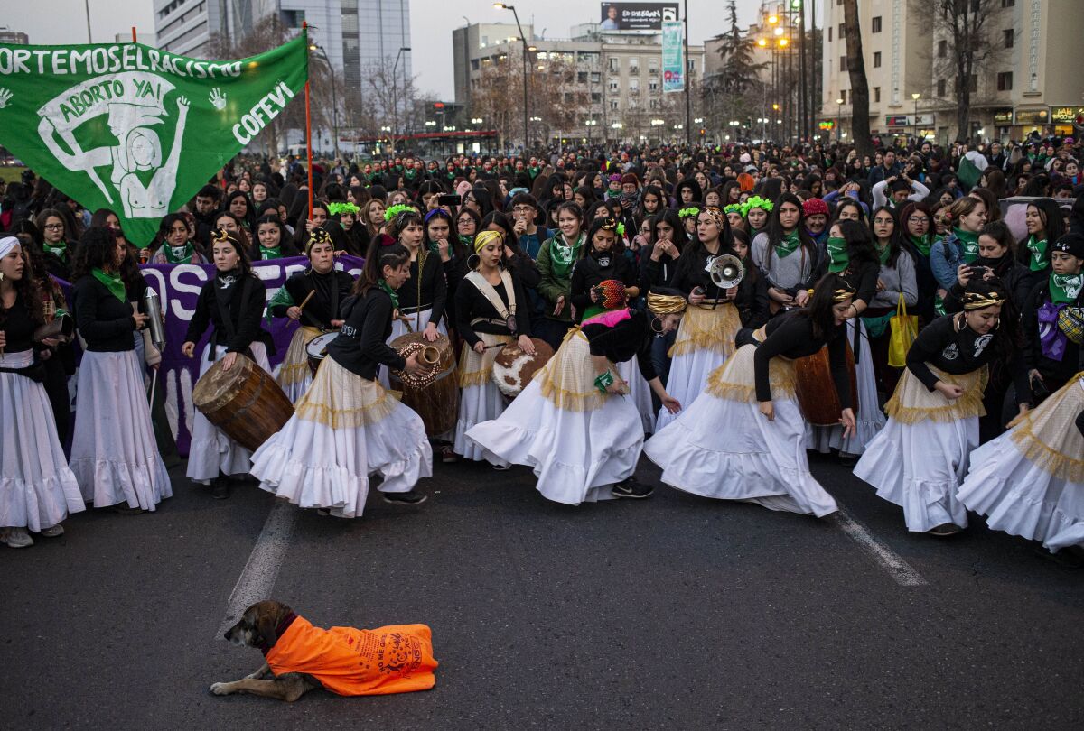 Women dance during a march in favor feminist movements