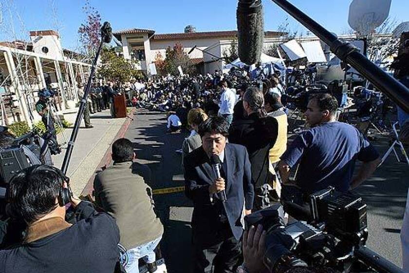 Press gather at the Santa Maria courthouse in 2003 when Santa Barbara County District Attorney Tom Sneddon faced journailsts after filing charges of child molestation against Michael Jackson.
