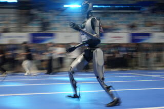 A robot rehearses the 100-meter race before the opening ceremony of the World Humanoid Robot Games in Beijing in August.
