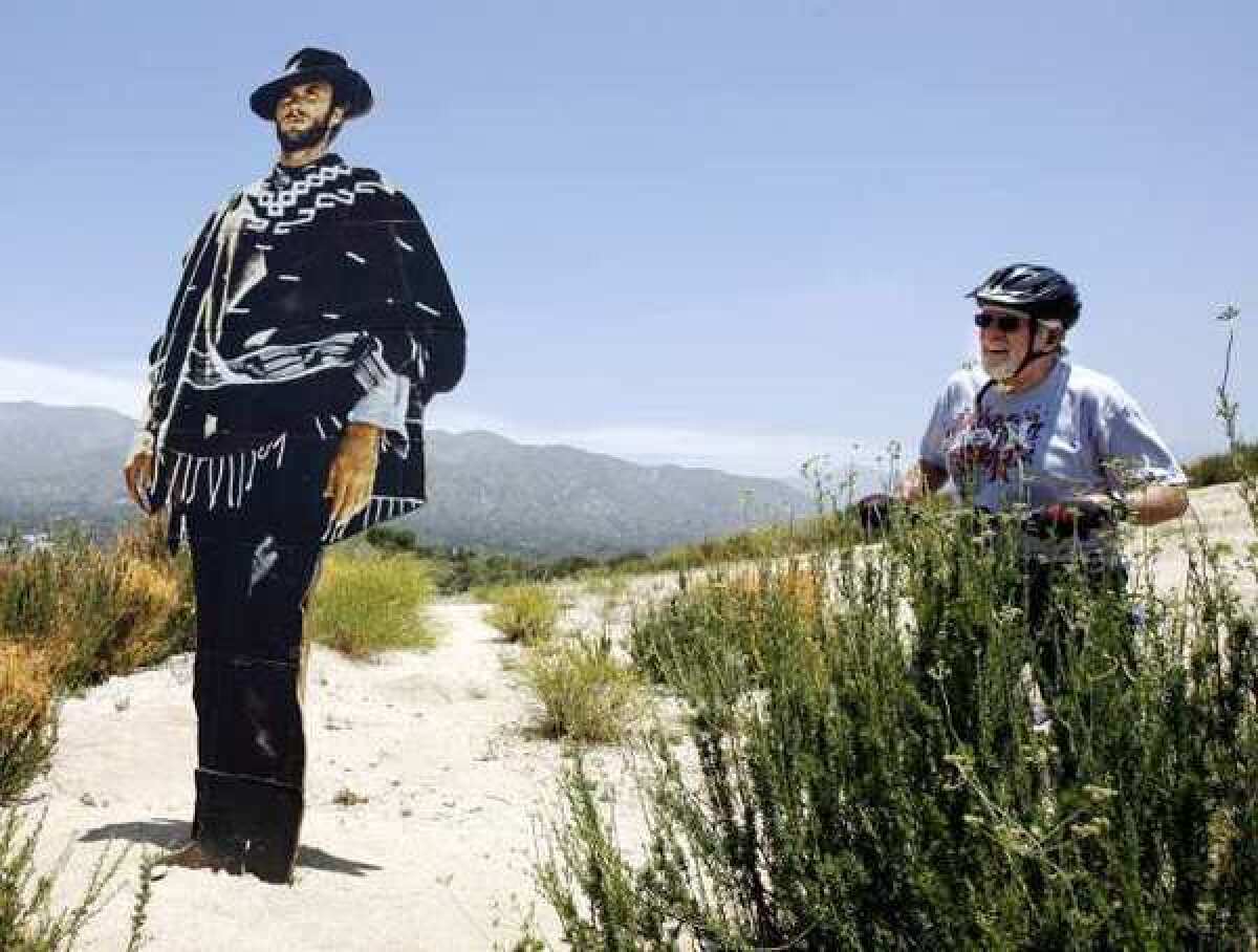 Ernie Hess of Montrose looks at a cut out of Clint Eastwood placed on a ridge at the top of the Verdugo Hills overlooking the Glendale (2) Freeway.