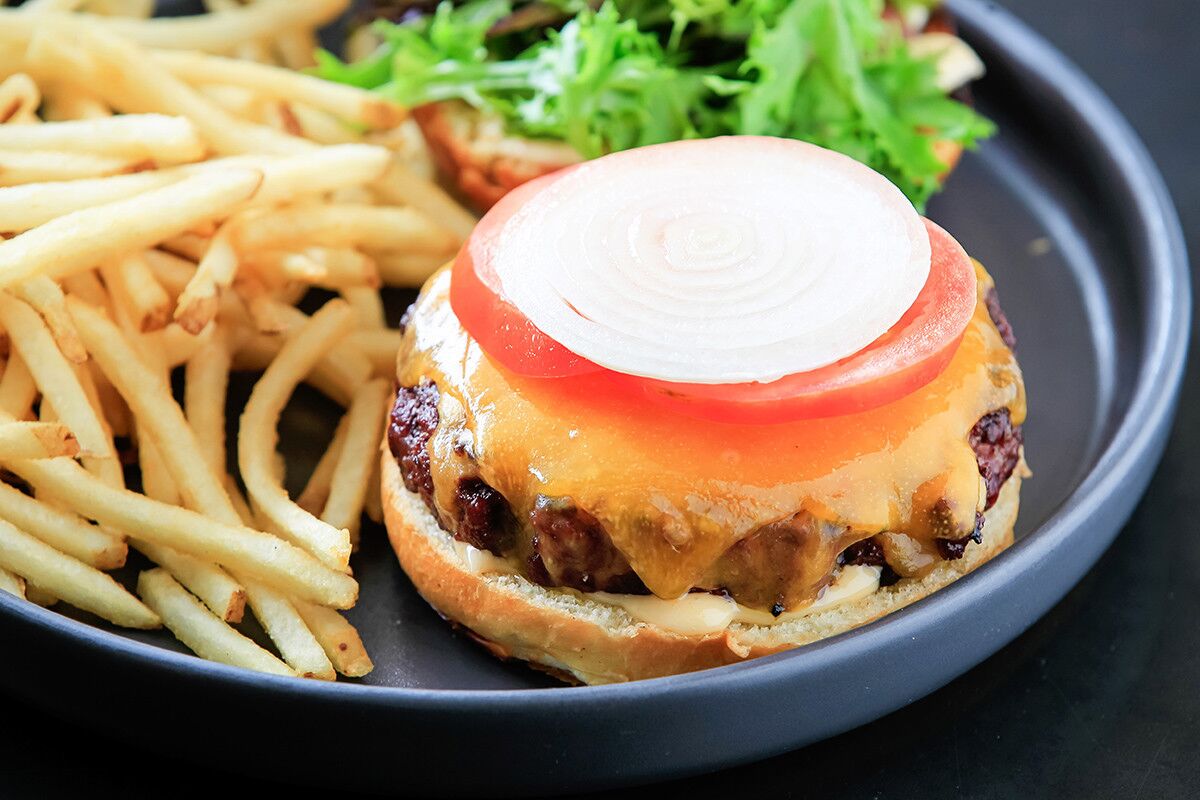 The 608 dry-aged beef burger with cheddar and sweet chili aoili. (Eduardo Contreras/Union-Tribune)