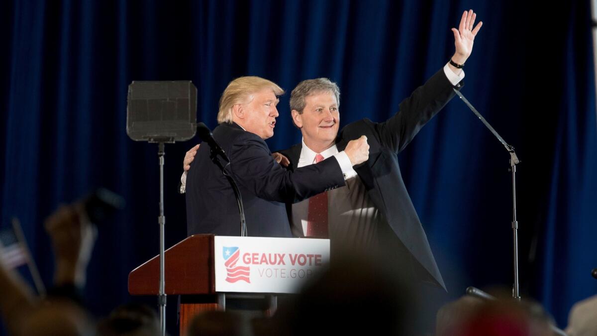 President-elect Donald Trump joins Republican Senate candidate John Kennedy at a rally Friday in Baton Rouge.