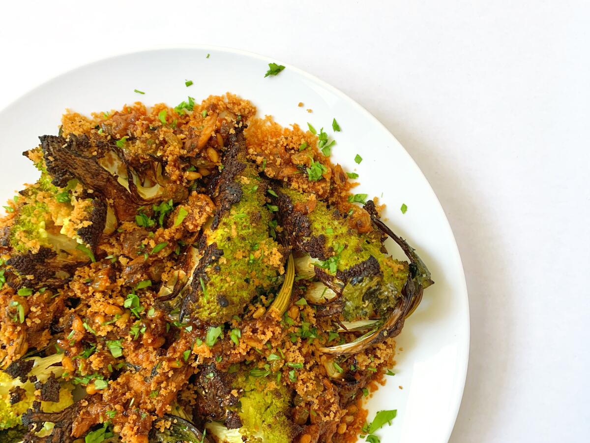 Roasted romanesco with a sauce of pine nuts, golden raisins, saffron and sardines