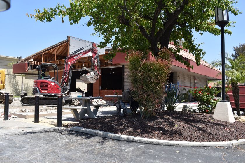 A construction crew removing the old dining room at the Jack in the Box along Bernardo Center Drive in Rancho Bernardo.