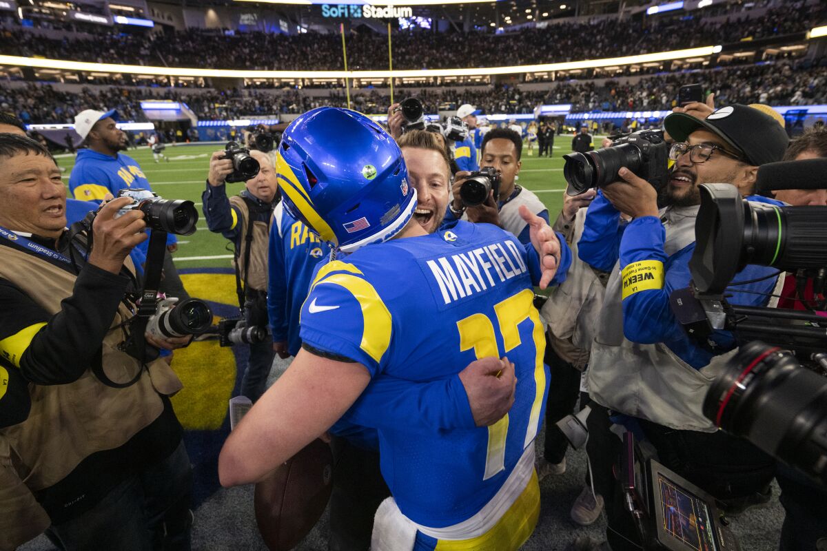 Rams coach Sean McVay hugs quarterback Baker Mayfield after a 17-16 comeback victory over the Raiders.