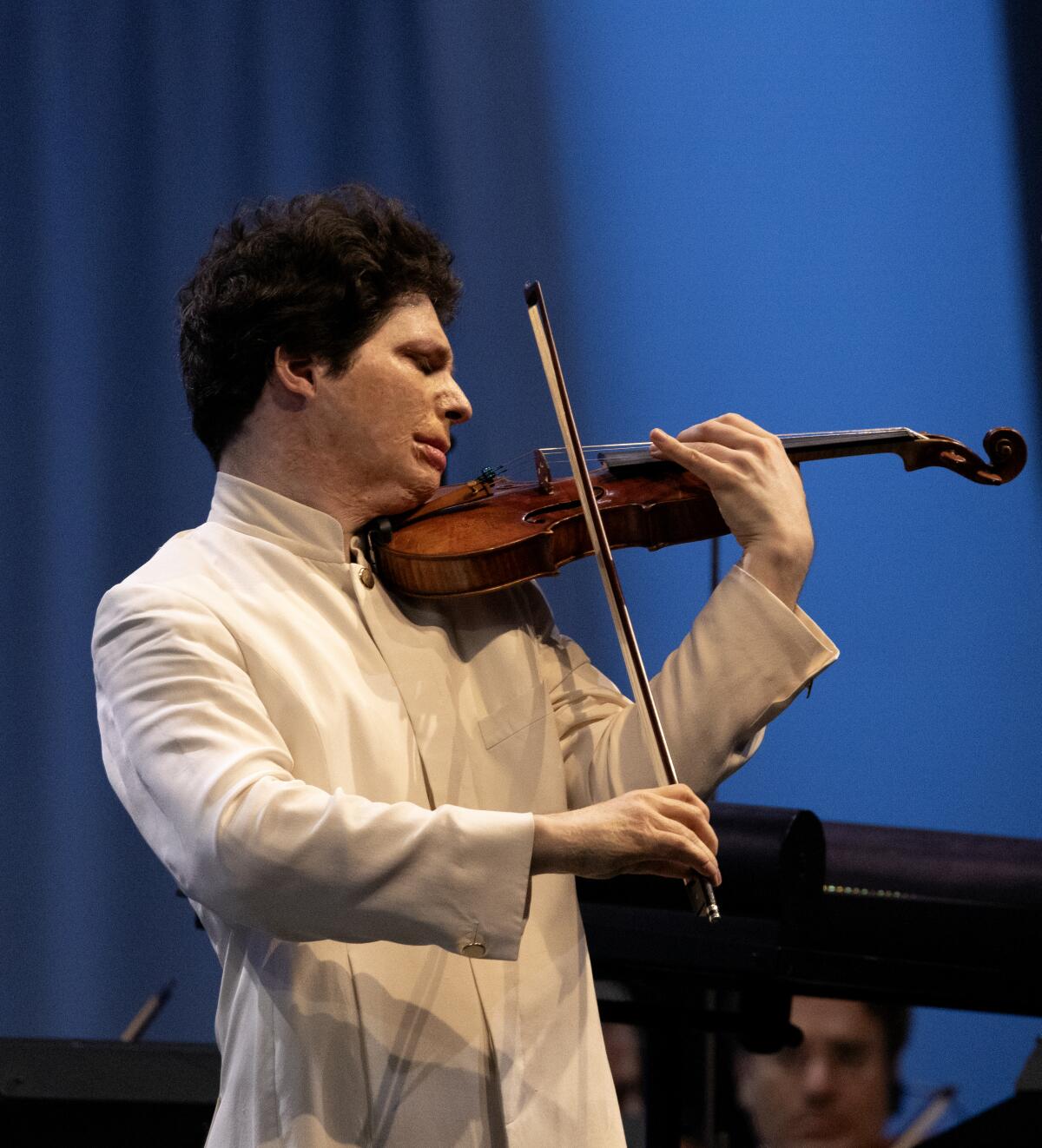 Soloist Augustin Hadelich plays the violin at the Bowl.