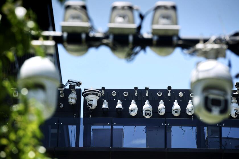 This picture shows Dahua surveillance cameras being installed on the Dahua Technologies office building in Hangzhou, in east China's Zhejiang province on May 29, 2019. (Photo by STR / AFP) / China OUT (Photo by STR/AFP via Getty Images)