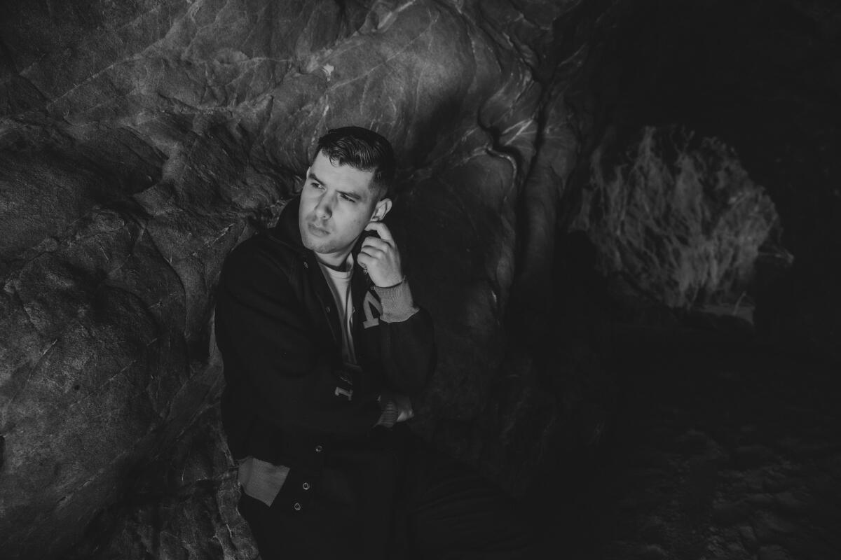 Man posing in a cave