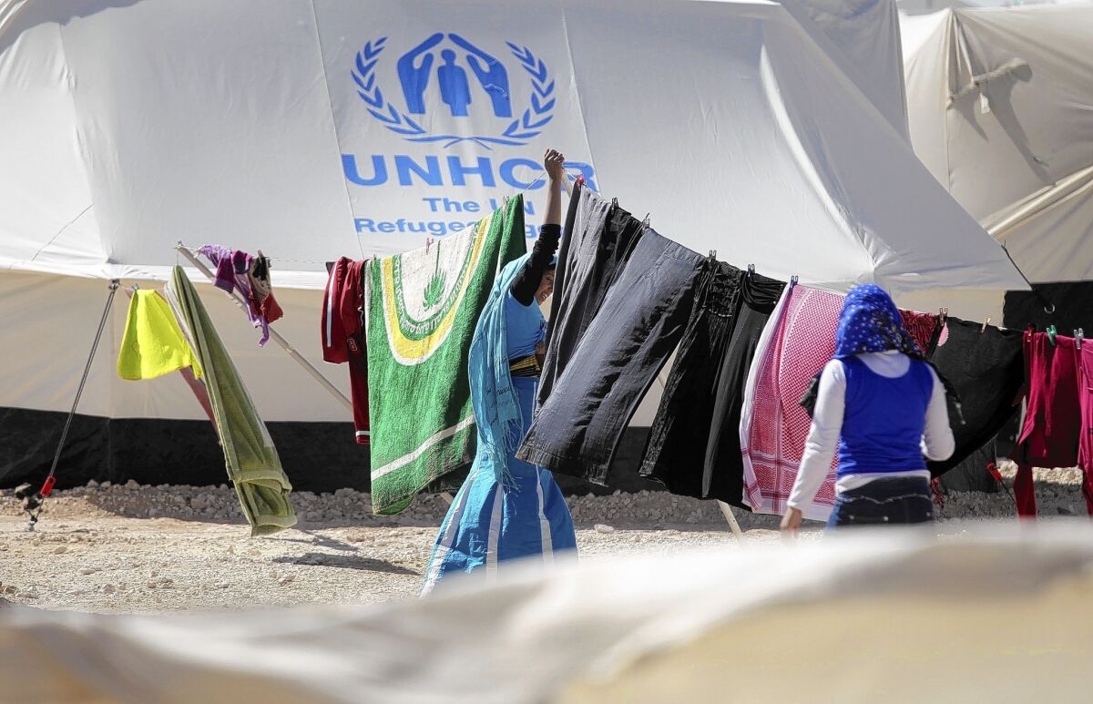 Syrian refugees hang their clothes to dry at the Zaatari camp in Jordan.
