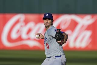 Dodgers pitcher Jack Flaherty throws to an Athletics batter during the first inning Saturday in Oakland.