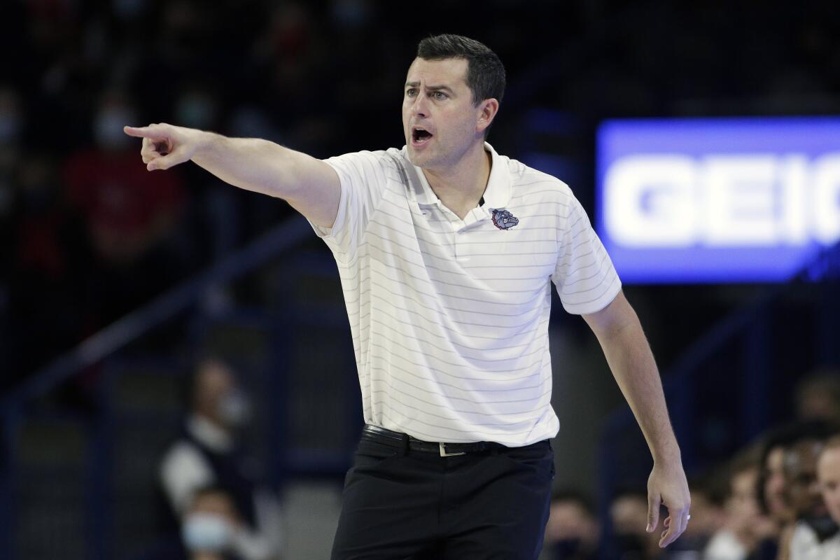 Gonzaga assistant coach Brian Michaelson directs his team during the first half of an NCAA college basketball game against Dixie State, Tuesday, Nov. 9, 2021, in Spokane, Wash. (AP Photo/Young Kwak)
