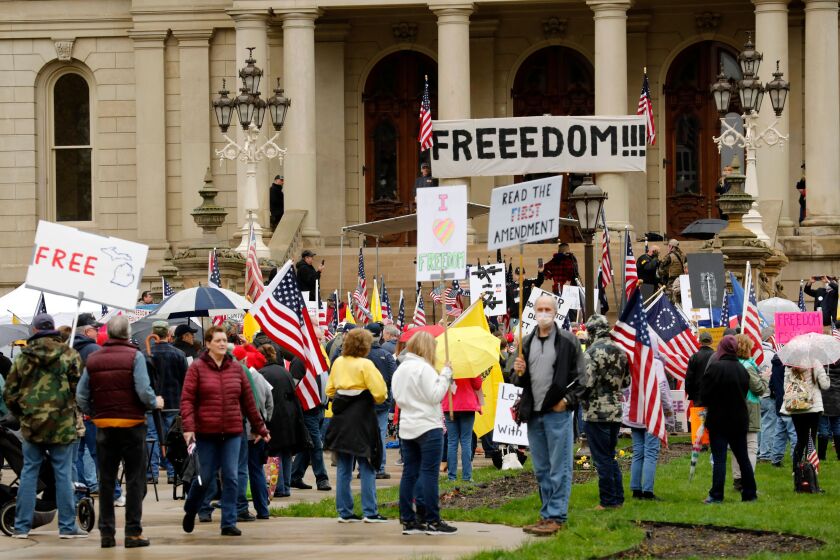 Demonstrators at a rally on the steps of the Michigan State Capitol on April 30, demanding the reopening of businesses.