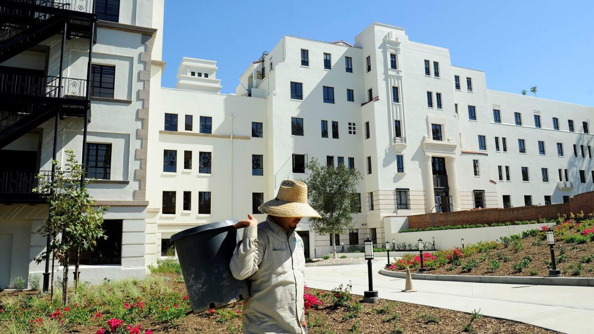 A gardener works in the yard at the former Linda Vista Hospital in 2015. The hospital is now the Hollenbeck Terrace senior apartment building.