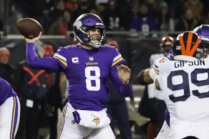 Minnesota Vikings quarterback Kirk Cousins passes during the first half of an NFL football game against the Chicago Bears Monday, Dec. 20, 2021, in Chicago. (AP Photo/Charles Rex Arbogast)