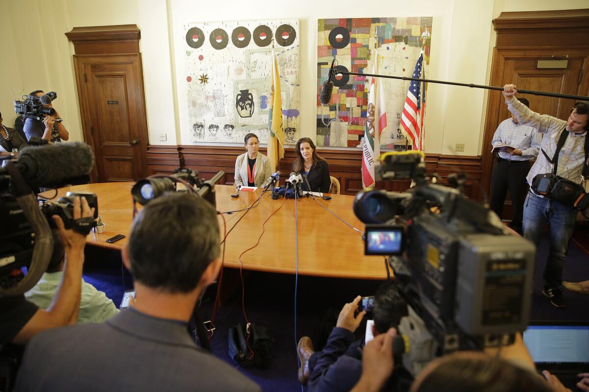 Oakland Mayor Libby Schaaf, right, sits with city administrator Sabrina Landreth during a news conference last week about the city's widening Police Department sex scandal.