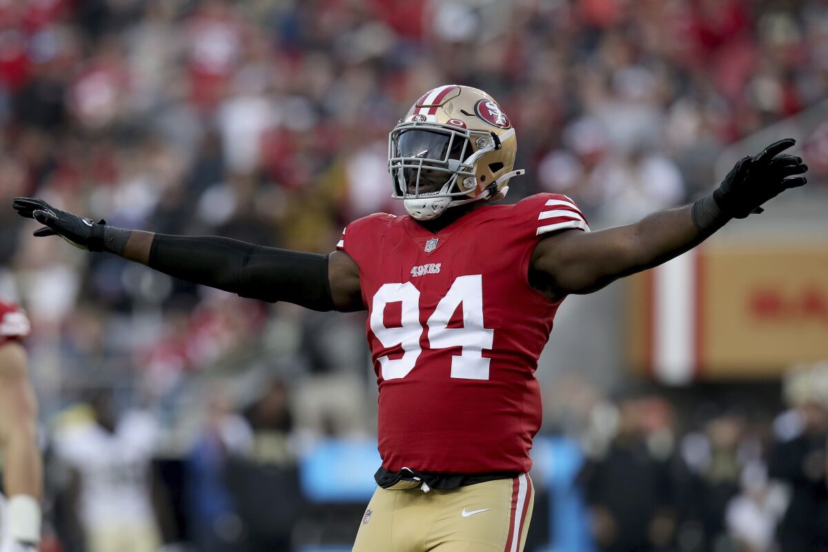 San Francisco 49ers defensive end Charles Omenihu celebrates during a game against the New Orleans Saints.