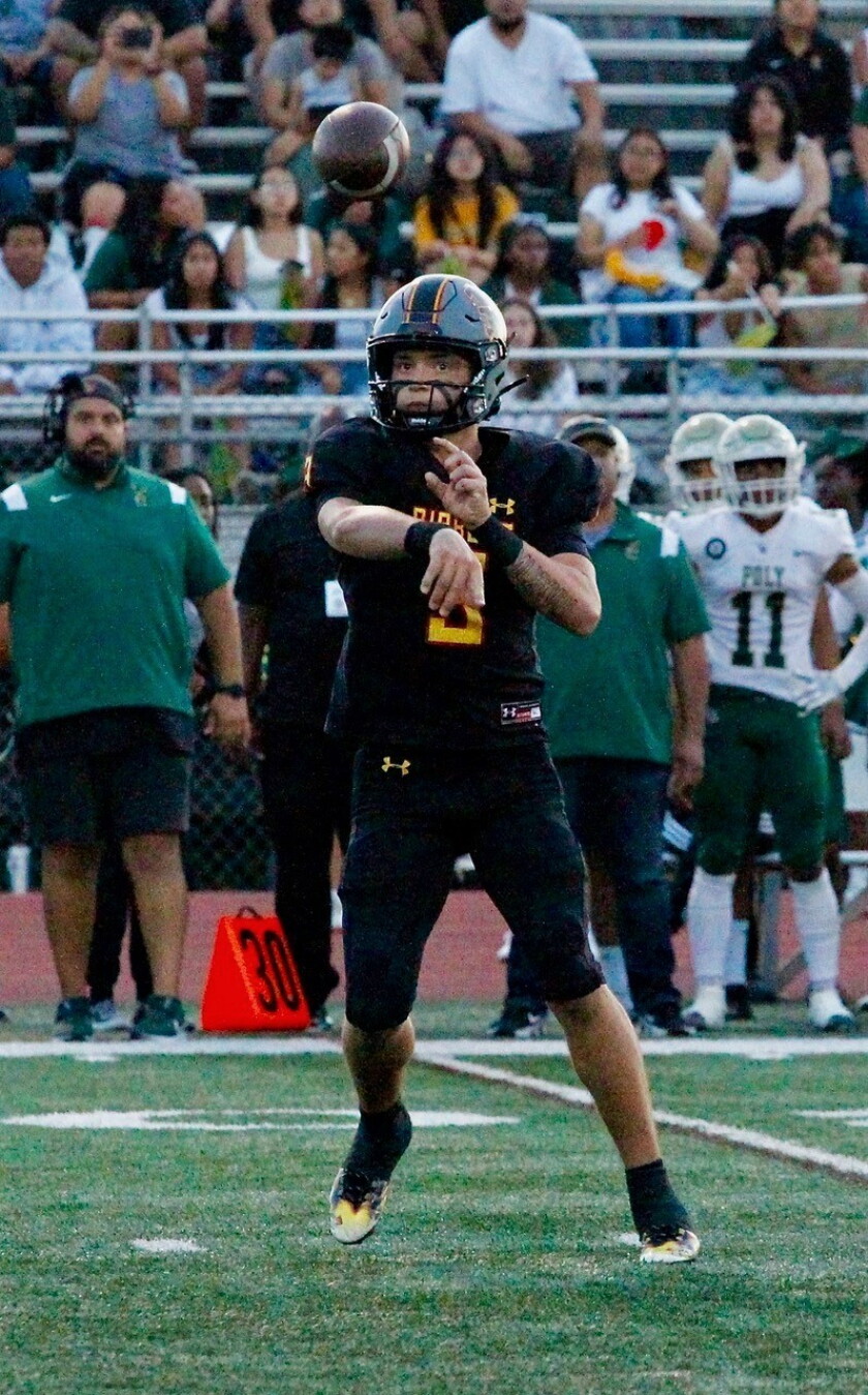 Mission Viejo quarterback Kadin Semonza releases a pass against Poly on Friday night.