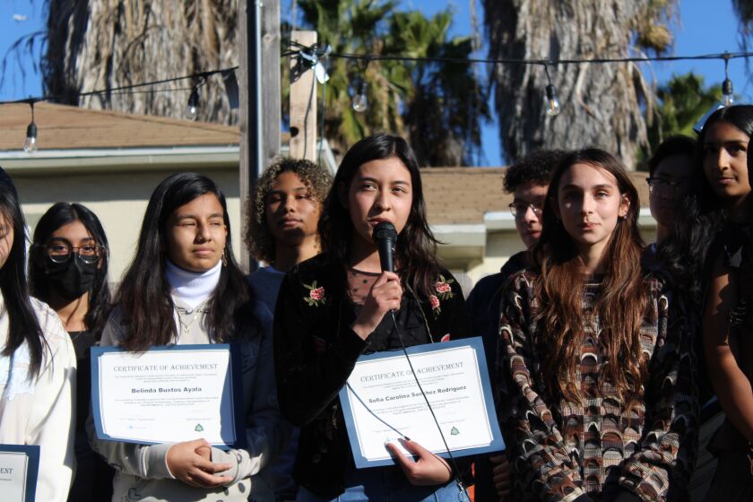 Sofia Sanchez (center, with microphone) and Summer Kocher (right) 