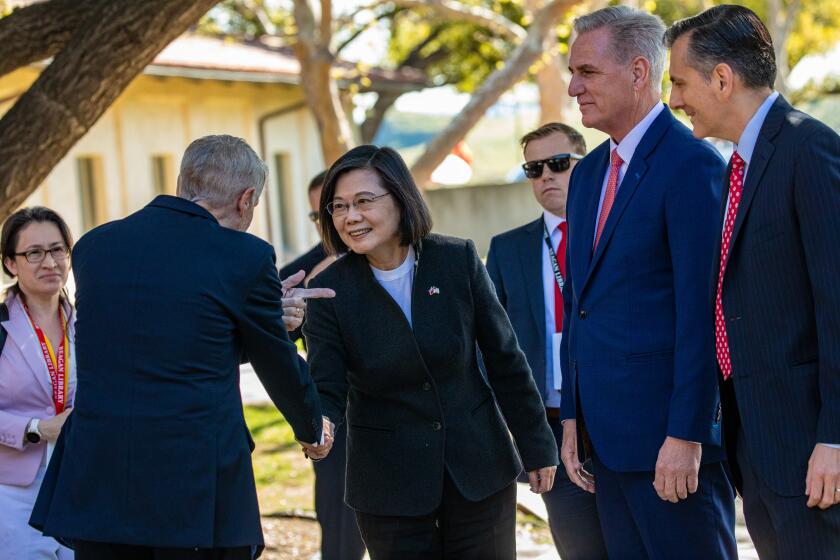 SIMI VALLEY, CA - APRIL 05: Former Executive Director of the Ronald Reagan Presidential Foundation and Institute John Heubusch, left, receives Taiwan President Tsai Ing-wen, flanked by House Speaker Kevin McCarthy, 2nd from right, and David Trulio, President and CEO of Ronald Reagan Presidential Foundation and Institute, as she arrives at Ronald Reagan Presidential Library on Wednesday, April 5, 2023 in Simi Valley, CA. (Irfan Khan / Los Angeles Times)