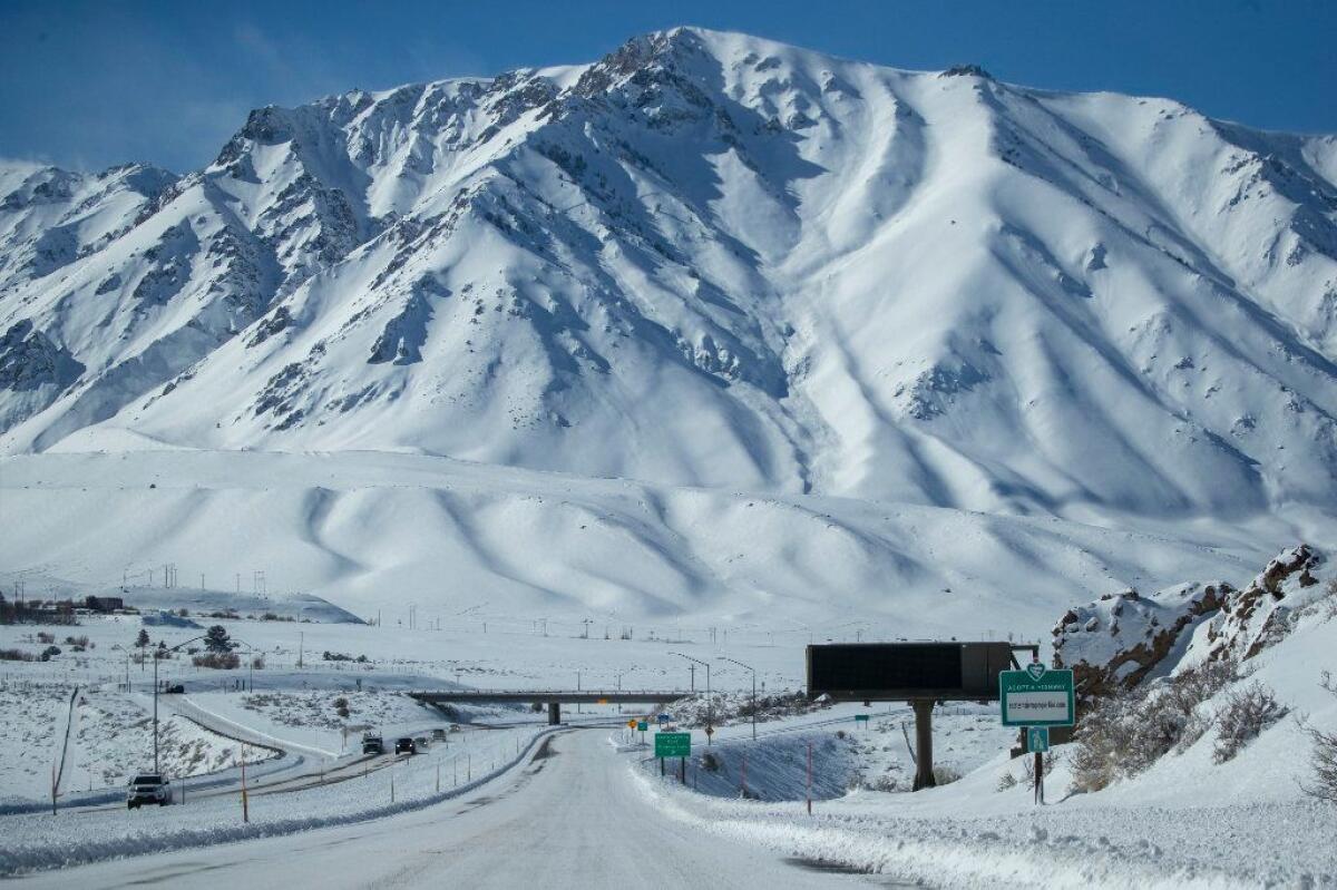 Snow blankets Highway 395 and the Eastern Sierra Nevada Mountains earlier this month after a blizzard dropped as much as 10 feet of snow near Mammoth Lakes.