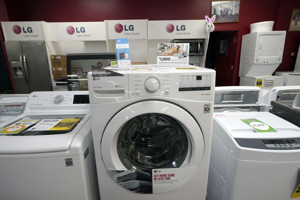 Washing machines are displayed at an appliance store