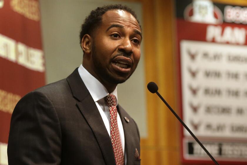 Martin Jarmond, newly hired Boston College athletic director, takes questions from members of the media Monday, April 24, 2017, during a news conference on the schools campus, in Boston. Jarmond was the deputy athletic director at Ohio State, and chief of staff for Buckeyes athletic director Gene Smith. (AP Photo/Steven Senne)