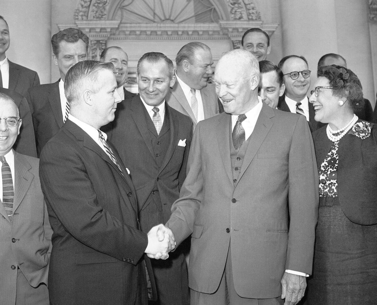 Rep. Arch Alfred Moore Jr. of West Virginia greets President Dwight D. Eisenhower in 1960 after a breakfast at the White House with other Republicans in Congress.