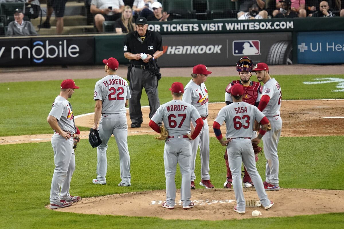 St. Louis Cardinals starting pitcher Jack Flaherty (22) walks to the dugout after being pulled from an interleague baseball game by manager Mike Shildt in the fourth inning against the Chicago White Sox Tuesday, May 25, 2021, in Chicago. (AP Photo/Charles Rex Arbogast)