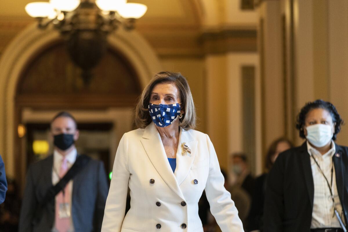 House Speaker Nancy Pelosi of Calif., walks from the House floor, during the vote on the Democrat's $1.9 trillion COVID-19 relief bill, on Capitol Hill, Wednesday, March 10, 2021, in Washington. (AP Photo/Alex Brandon)