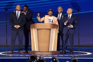 CHICAGO, IL AUGUST 22, 2024 - Kevin Richardson, center, joined by fellow members of The Exonerated Five, Korey Wise, from left, Yusef Salaam, and Raymond Santana, right, along with Rev. Al Sharpton, second right, speak during the Democratic National Convention Thursday, Aug. 22, 2024, in Chicago, IL. (Myung J. Chun/Los Angeles Times)